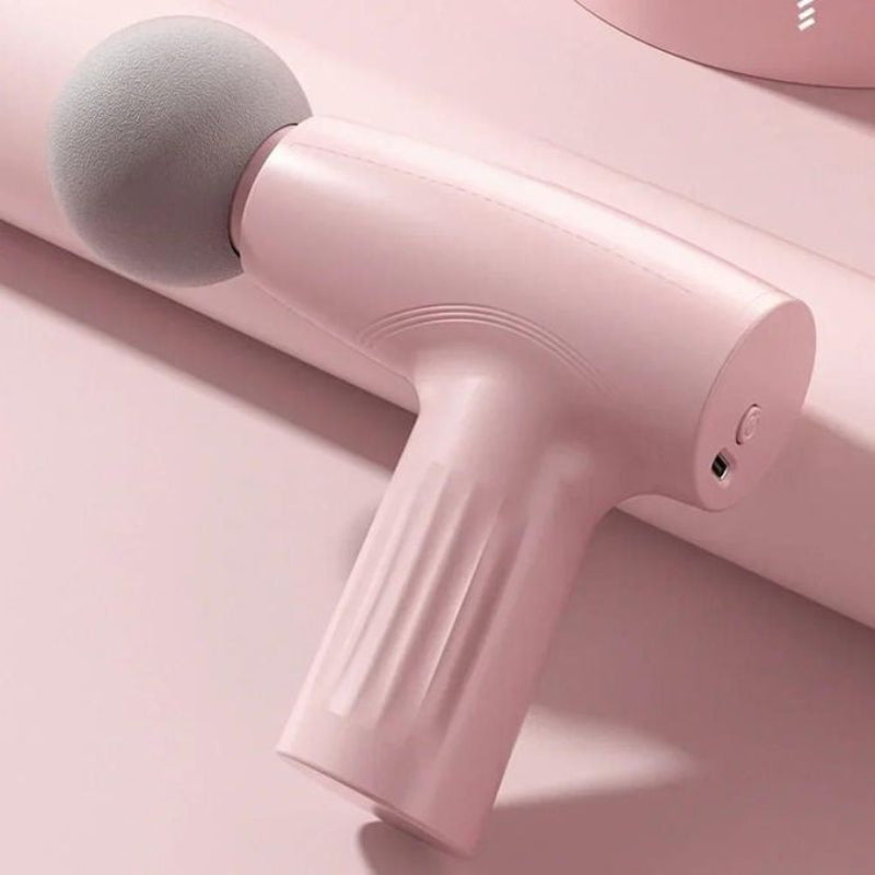 HNoori CoreRelief Mini Deep Tissue Massage Gun with ergonomic grip and multiple massage heads for muscle recovery and pain relief.